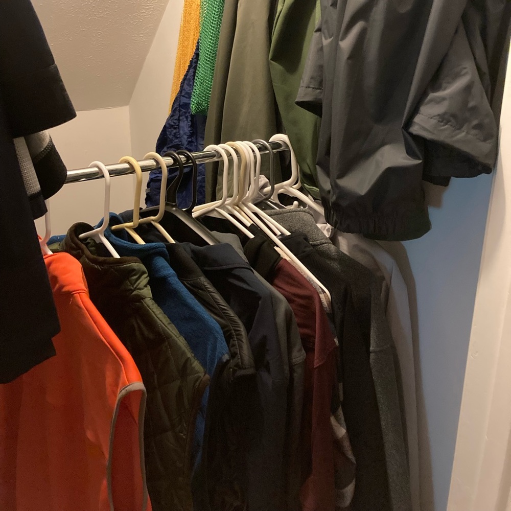 Various men's vests, light jackets, rain shells
